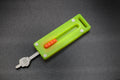 Green G10 with Orange Button - Middle Finger Fidget